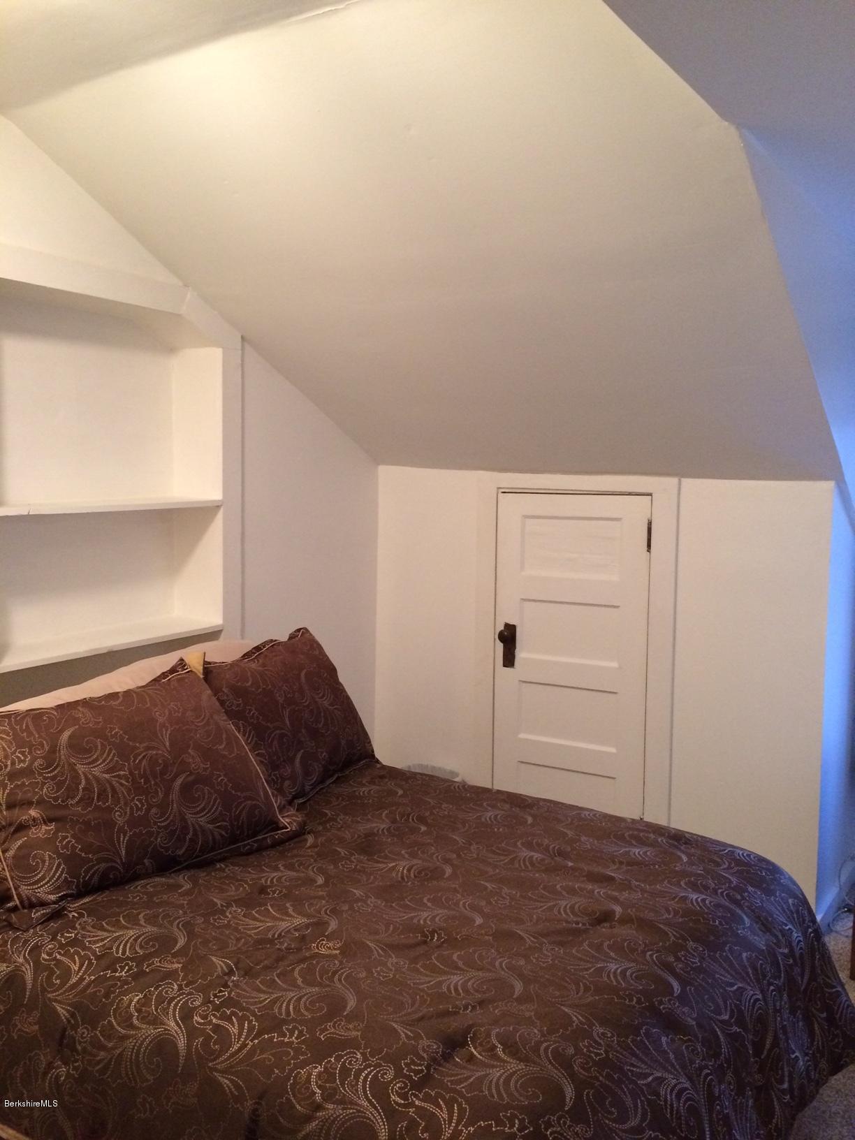 906 South Undermountain Road Sheffield, MA 01257 - Photo 7 of 12 a bedroom with a bed and a window