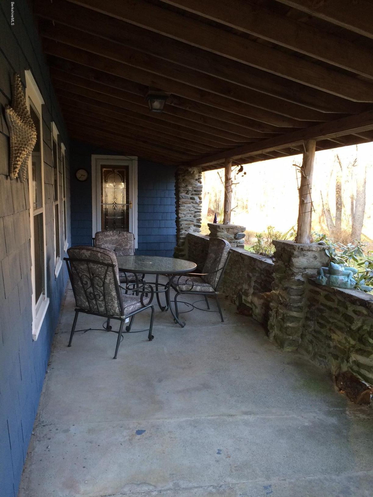 906 South Undermountain Road Sheffield, MA 01257 - Photo 9 of 12 a view of a chairs and table in the patio
