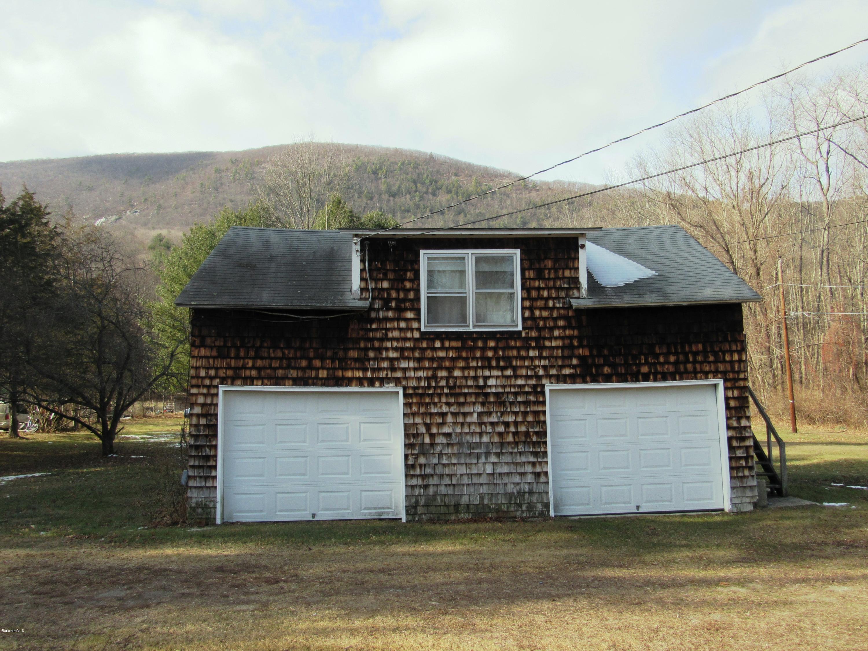 906 South Undermountain Road Sheffield, MA 01257 - Photo 10 of 12 a front view of a house with a yard
