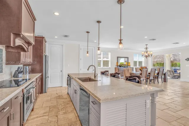 a kitchen with a sink and cabinets