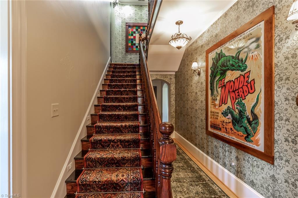 7867 Alcorn Road Oak Ridge, NC 27310 - Photo 22 of 50 Seller created an old time hotel entrance. The banister is a 20ft piece of yellow pine made by an Amish carpenter