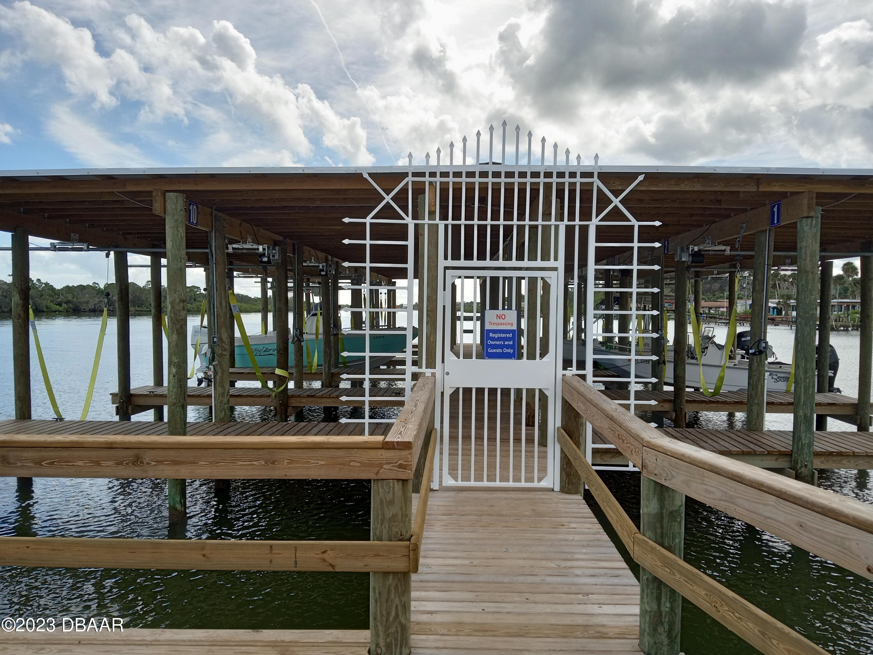 4332 Cedar Way Edgewater, FL 32141 - Photo 14 of 25 a view of house with a large window and wooden floor
