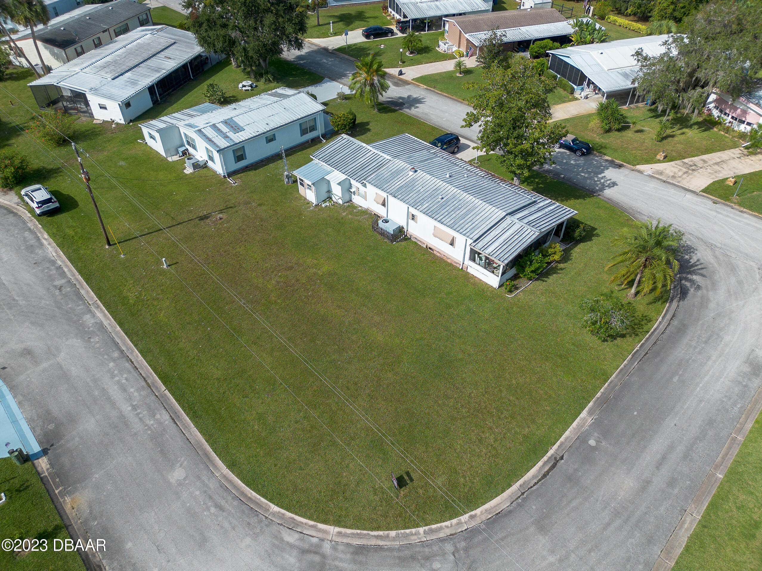 4332 Cedar Way Edgewater, FL 32141 - Photo 15 of 25 an aerial view of a house with a garden and swimming pool