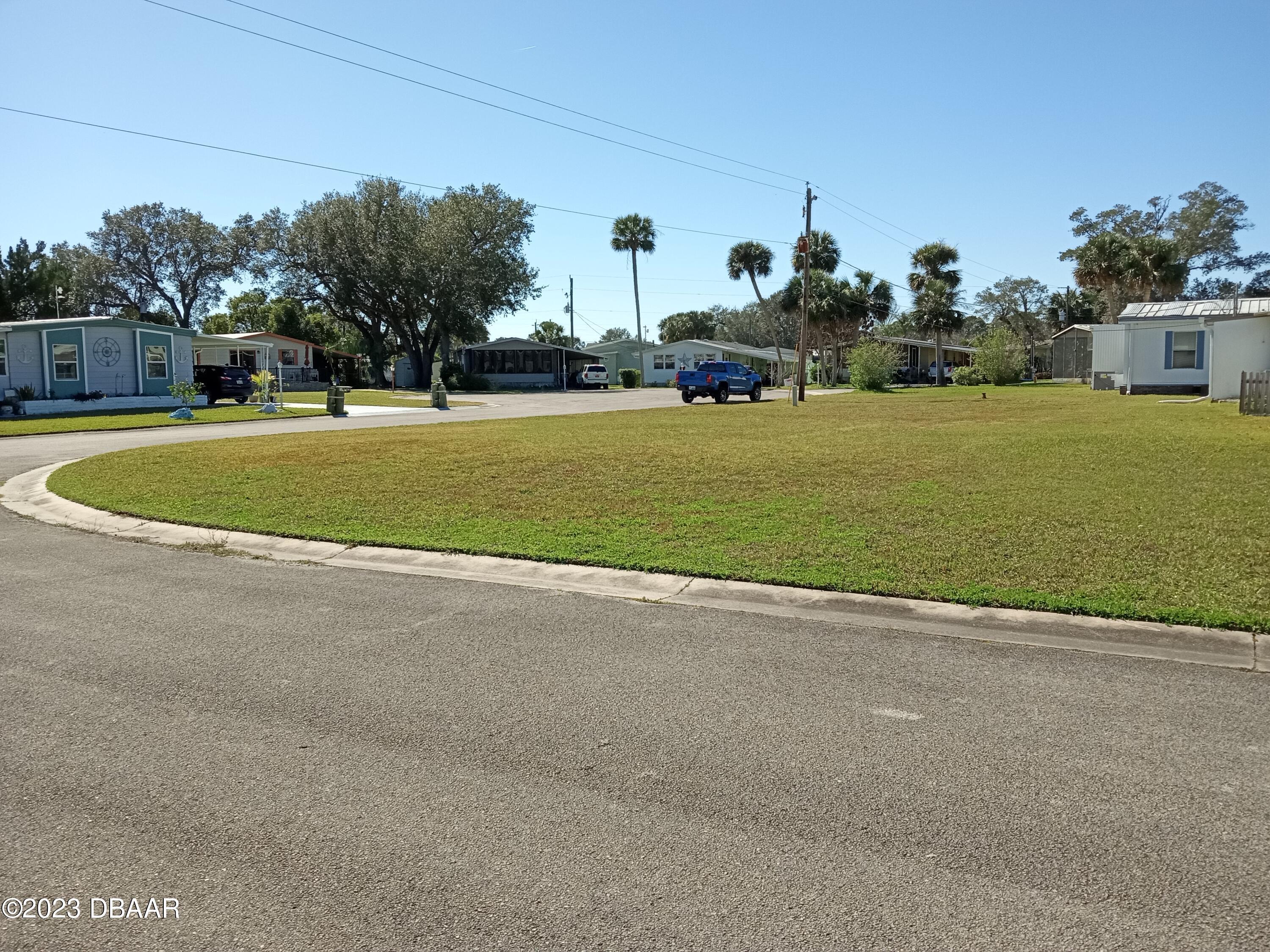 4332 Cedar Way Edgewater, FL 32141 - Photo 6 of 25 a view of a street with houses