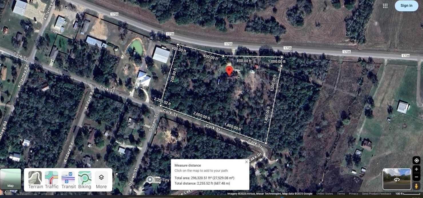 31365 B Fm 1736 Road Hempstead, TX 77445 - Photo 5 of 9 This aerial photo shows a spacious, wooded property outlined in white, located near a main road. It features a mix of trees and open areas, with neighboring homes nearby, offering a blend of privacy and community access.