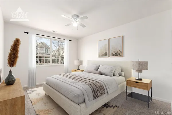 a bedroom with a bed and lamp with window
