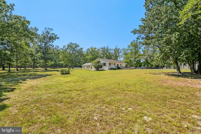 a view of a pool with an outdoor space and seating area