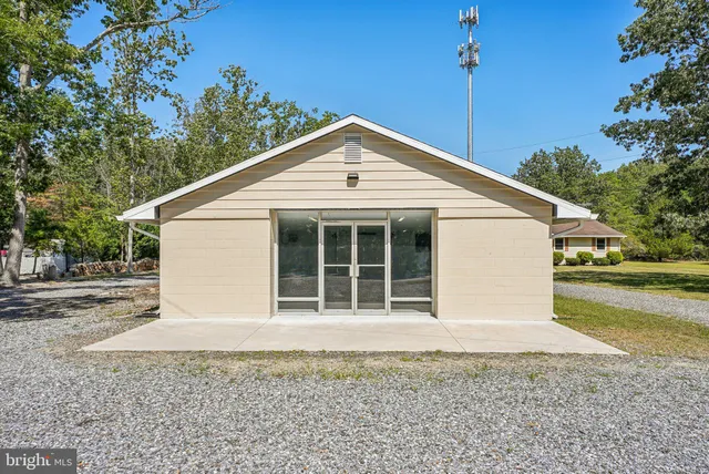 a house with trees in the background