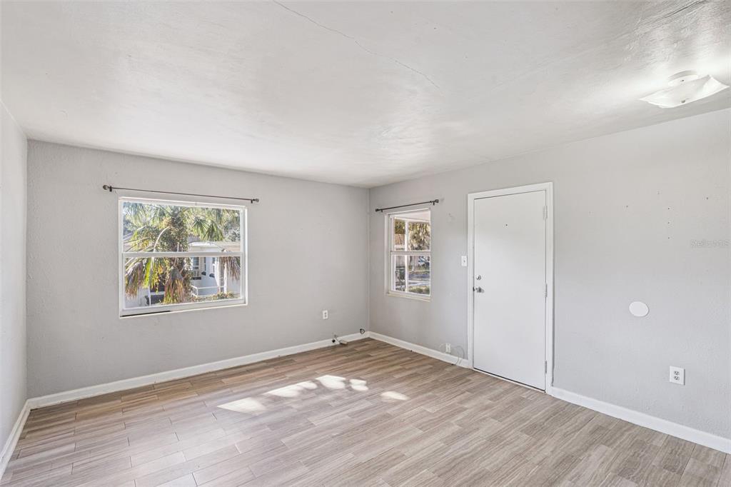 420 Euclid Avenue, Unit 1 Leesburg, FL 34748 - Photo 4 of 18 an empty room with windows