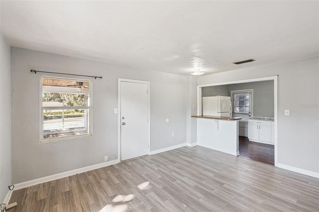 420 Euclid Avenue, Unit 1 Leesburg, FL 34748 - Photo 5 of 18 a view of empty room with wooden floor