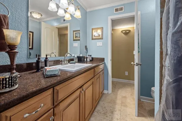 a bathroom with double sink and a mirror