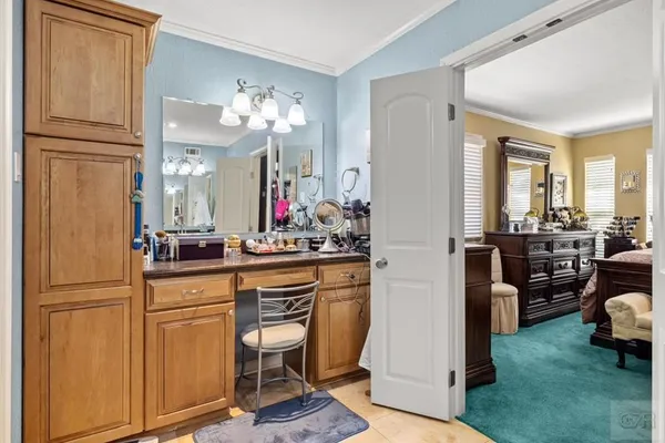 a kitchen with sink refrigerator and cabinets