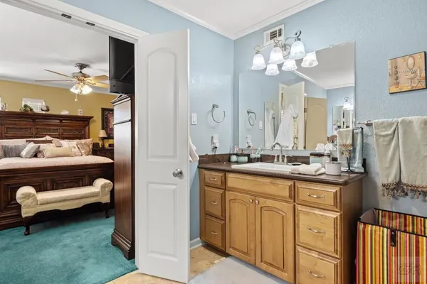 a bathroom with a sink double vanity and a mirror
