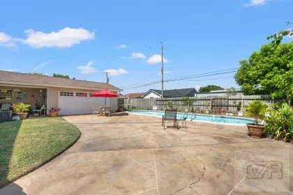 a view of a house with backyard and porch