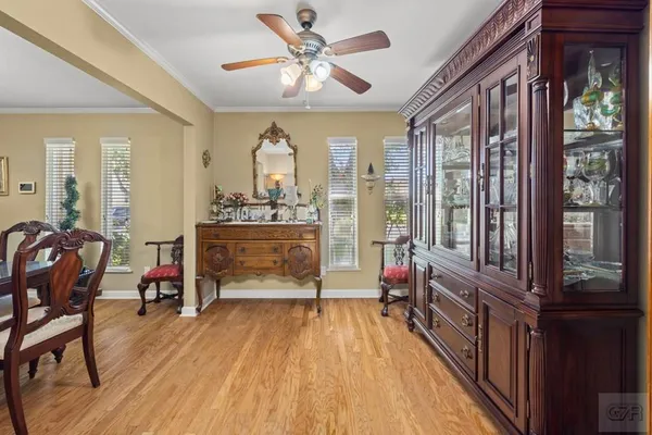 a living room with furniture a fireplace and a table