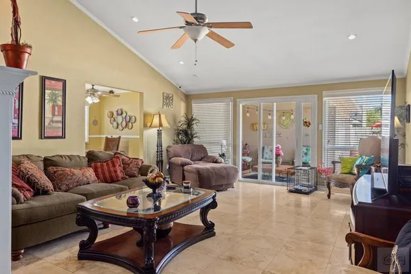 a living room with furniture and a large window