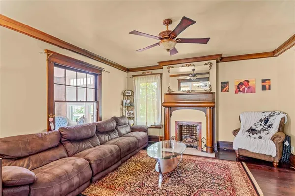a living room with furniture and a fireplace