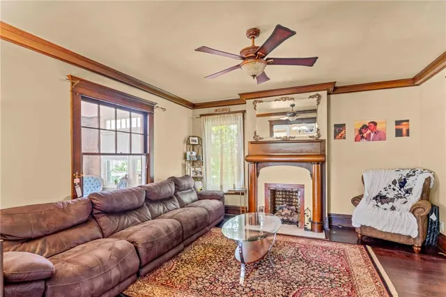 a living room with furniture and a fireplace