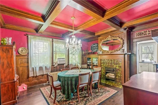 a view of an outside dining area with a table and chairs
