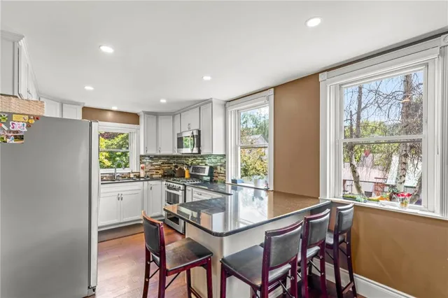 a kitchen with a table and chairs in it