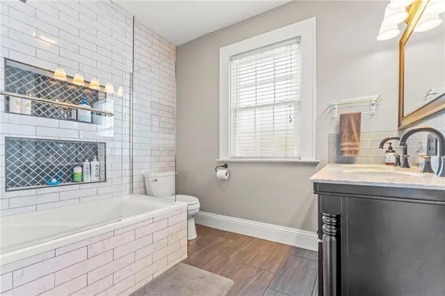 a bedroom with bed and a ceiling fan