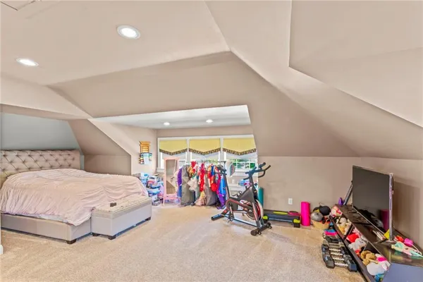 a view of a room with toys and a chandelier