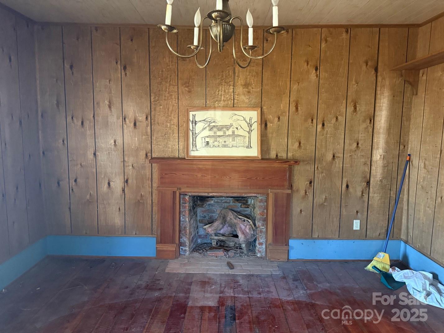 1801 Overbrook Road Kershaw, SC 29067 - Photo 10 of 19 a view of a livingroom with wooden floor and a fireplace