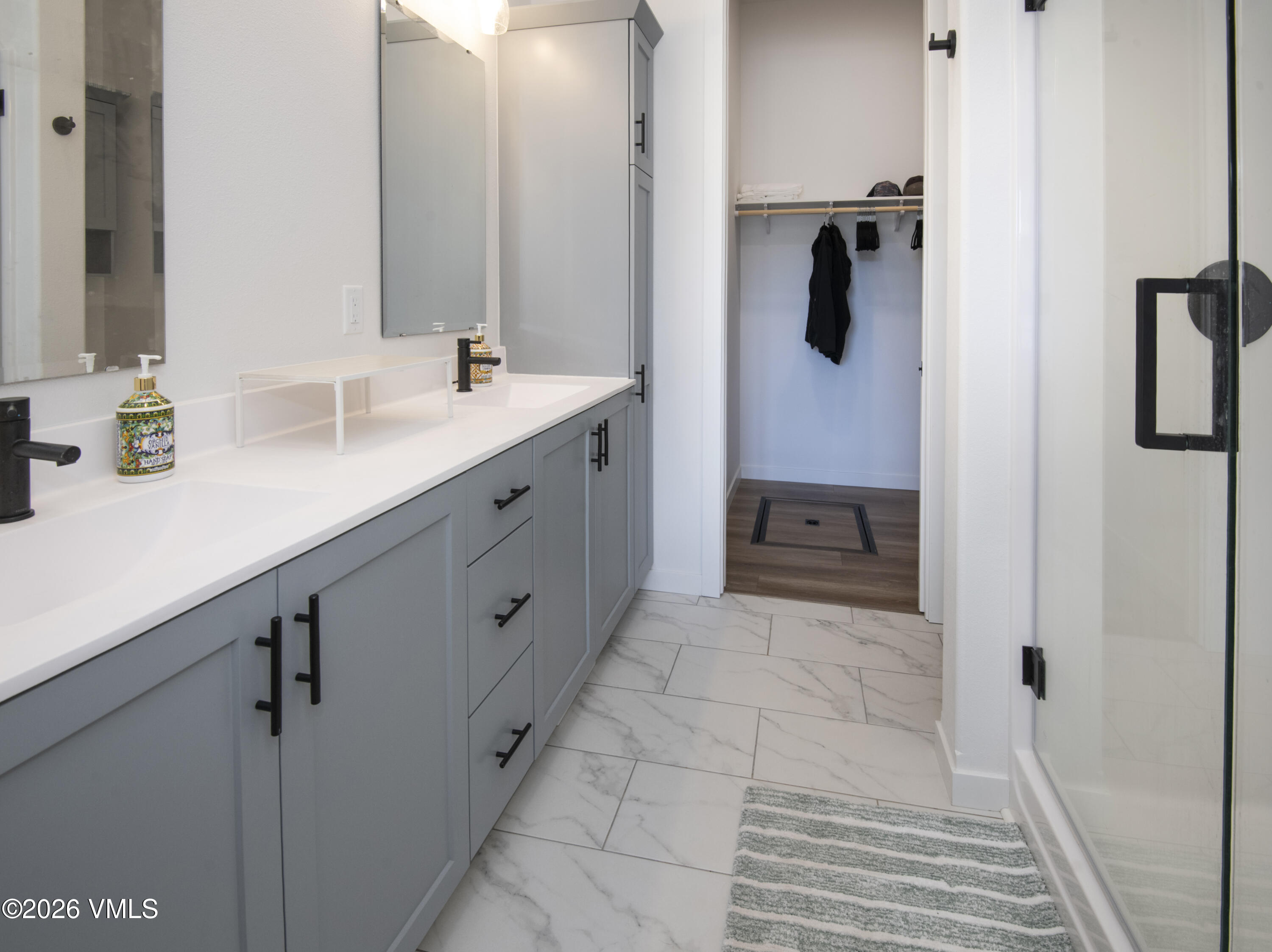 270 Blackhawk Road Gypsum, CO 81637 - Photo 12 of 27 a spacious bathroom with a double vanity sink a mirror and shower