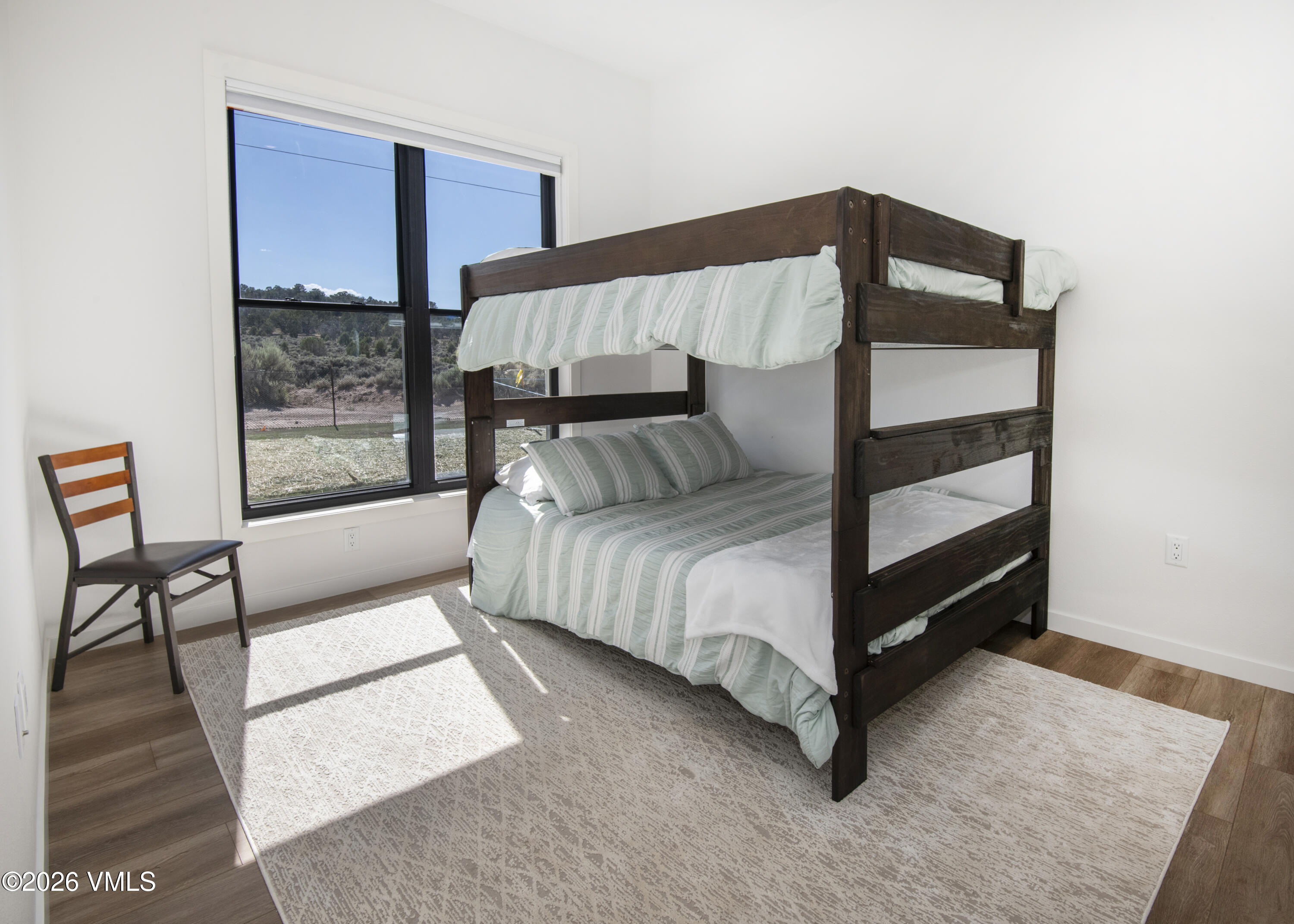 270 Blackhawk Road Gypsum, CO 81637 - Photo 16 of 27 a bedroom with a bed and a window