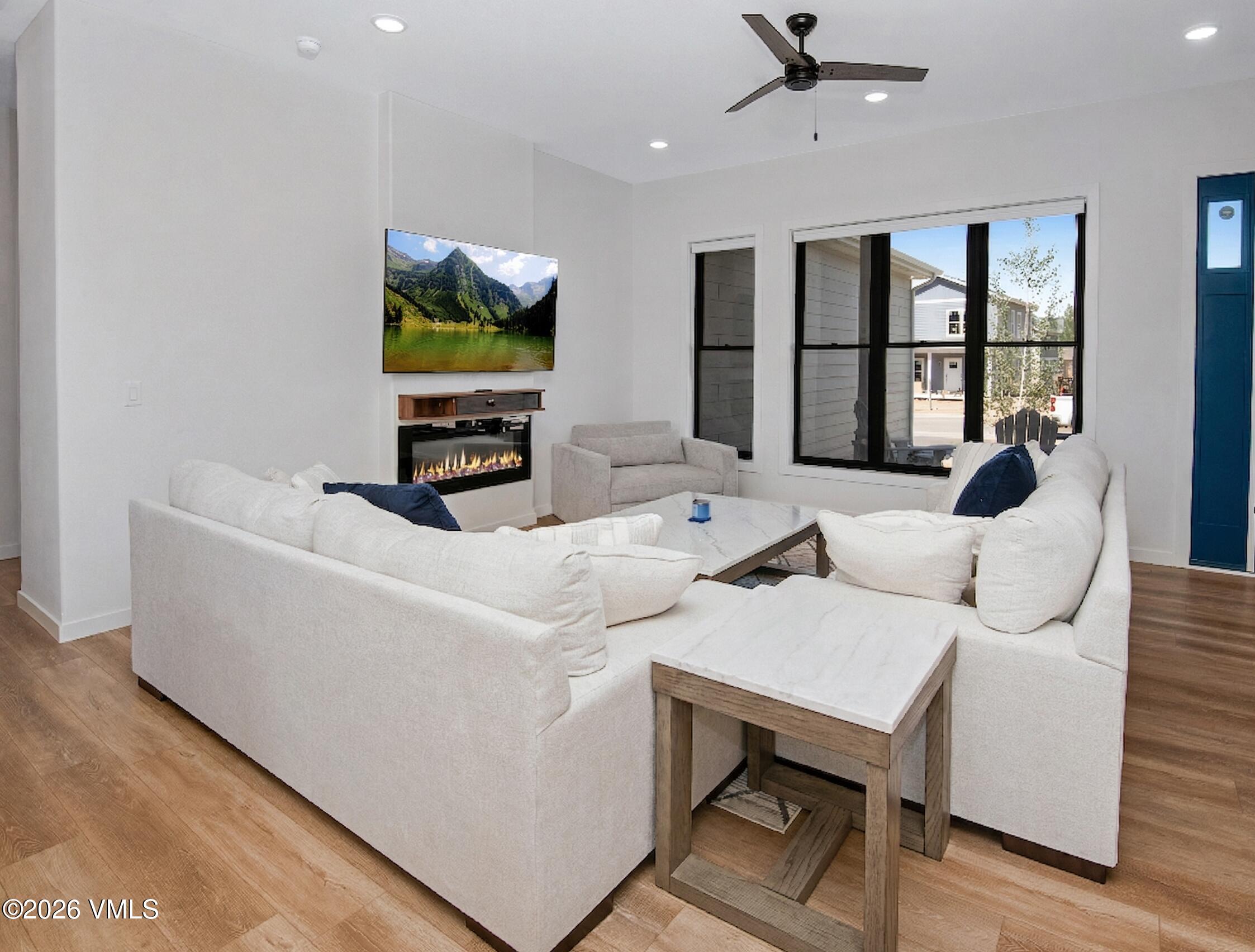 270 Blackhawk Road Gypsum, CO 81637 - Photo 4 of 27 a living room with furniture and a flat screen tv