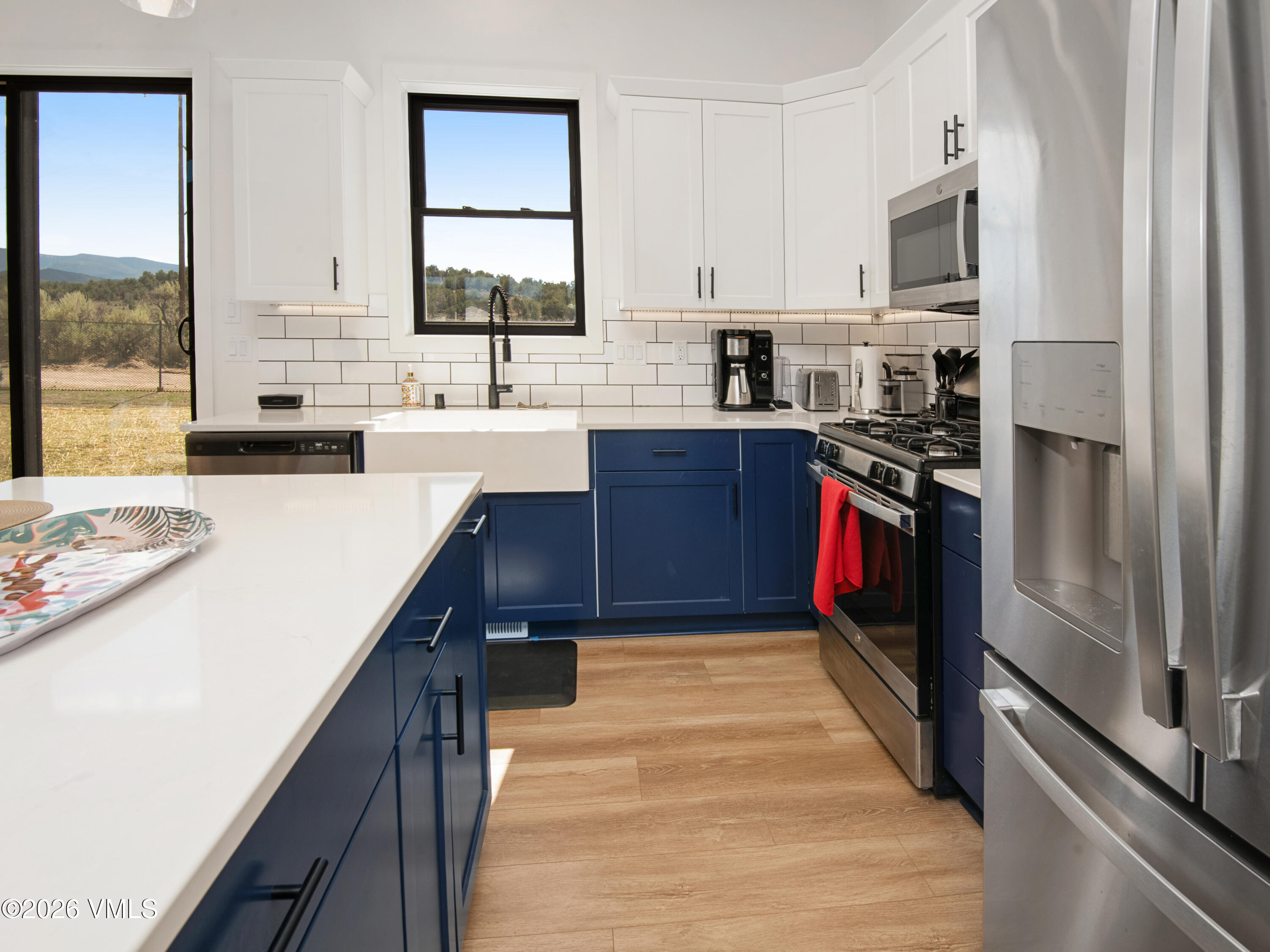 270 Blackhawk Road Gypsum, CO 81637 - Photo 7 of 27 a kitchen with stainless steel appliances granite countertop a sink stove and refrigerator