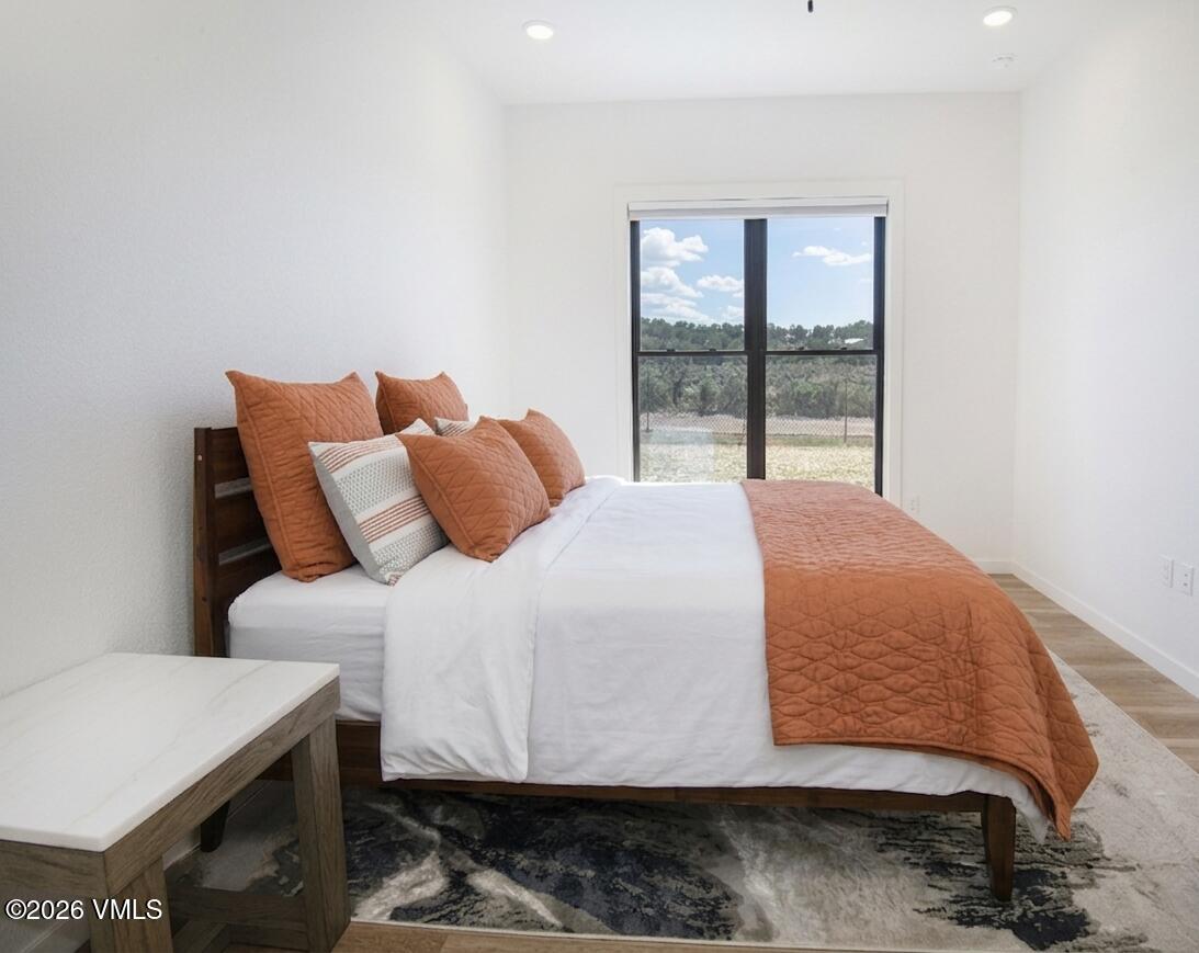 270 Blackhawk Road Gypsum, CO 81637 - Photo 10 of 27 a bedroom with a bed and a window