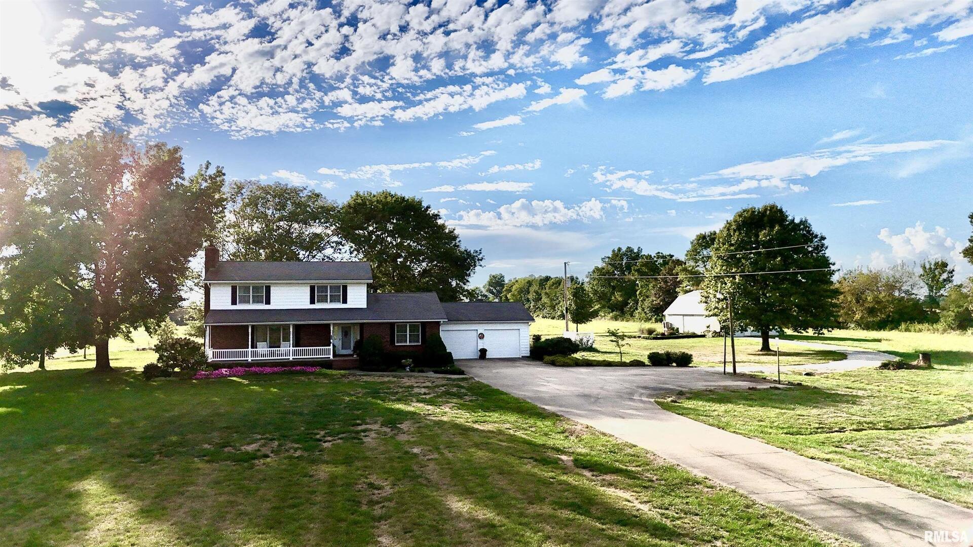 9879 Steel City Road Benton, IL 62812 - Photo 12 of 60 a view of a house with a yard