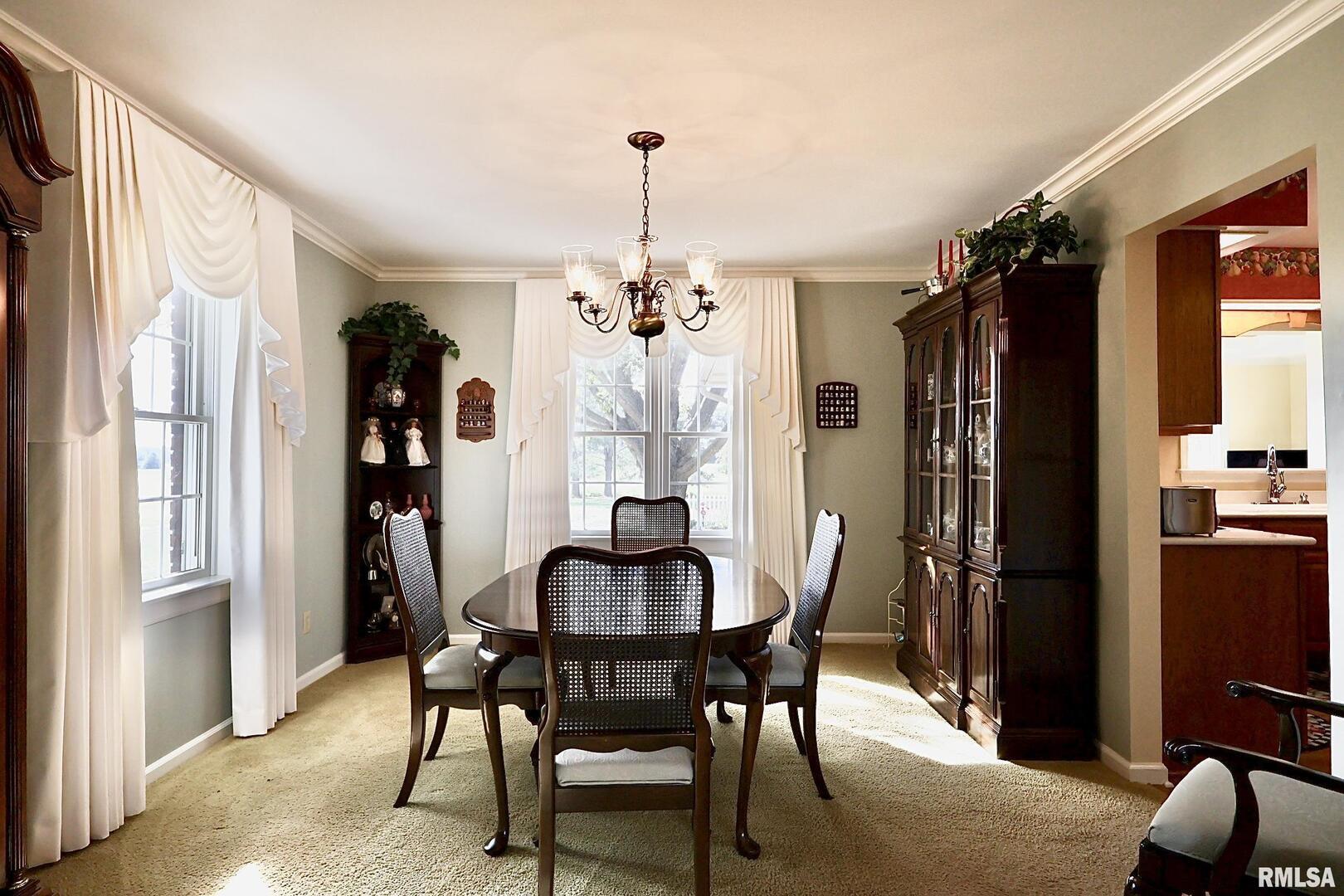 9879 Steel City Road Benton, IL 62812 - Photo 21 of 60 a dining room with furniture window and wooden floor