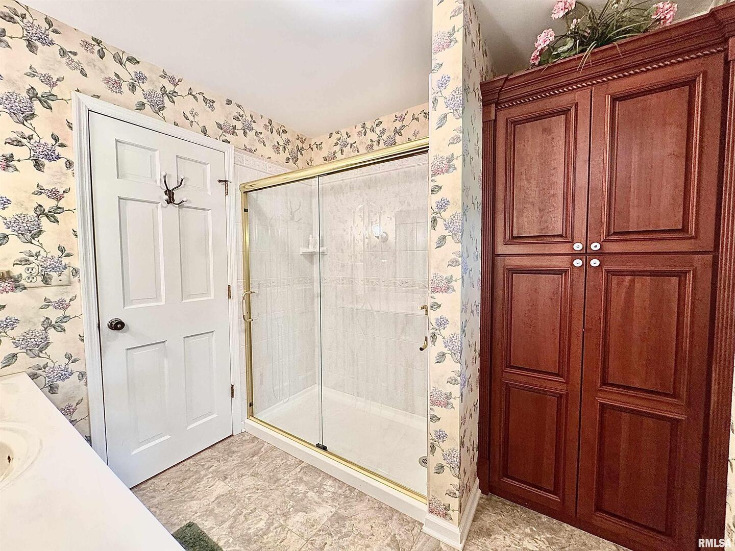 9879 Steel City Road Benton, IL 62812 - Photo 30 of 60 a bathroom with a shower and a sink