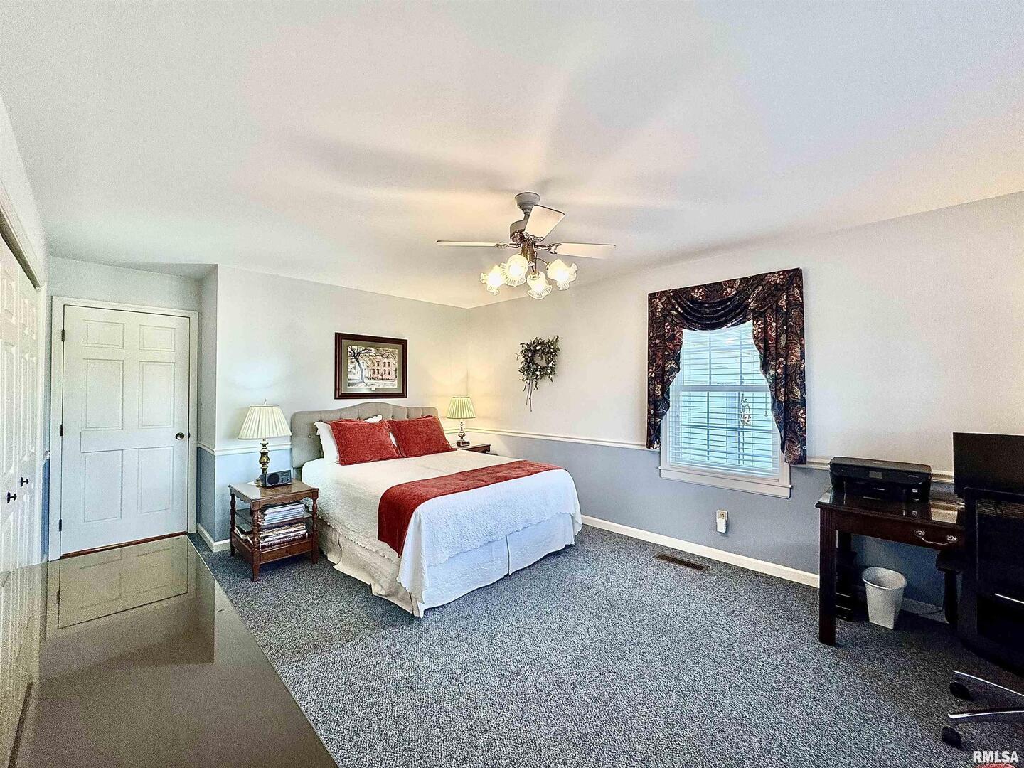 9879 Steel City Road Benton, IL 62812 - Photo 32 of 60 a bedroom with a bed and a window