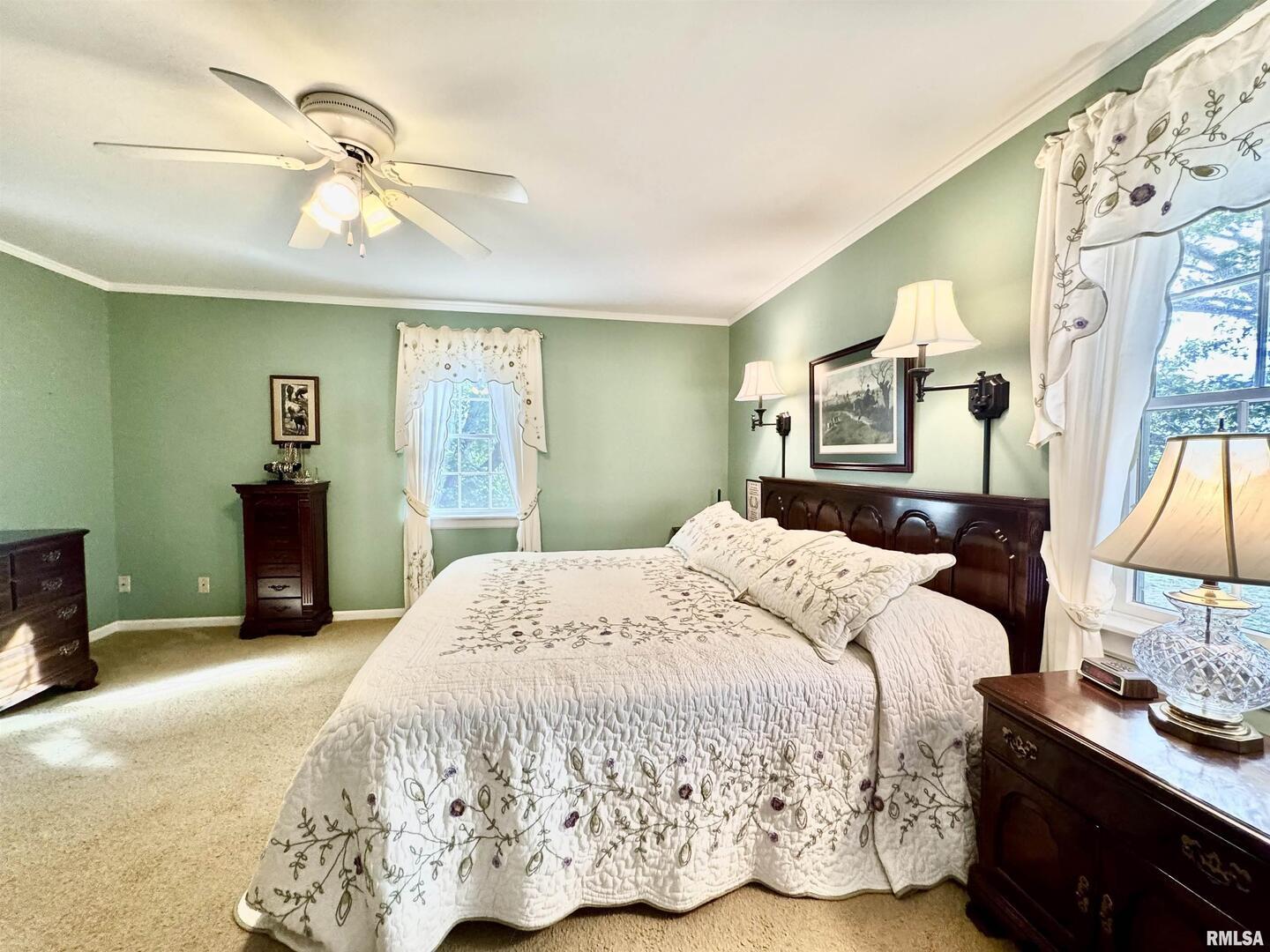 9879 Steel City Road Benton, IL 62812 - Photo 38 of 60 a bedroom with a bed and a chandelier