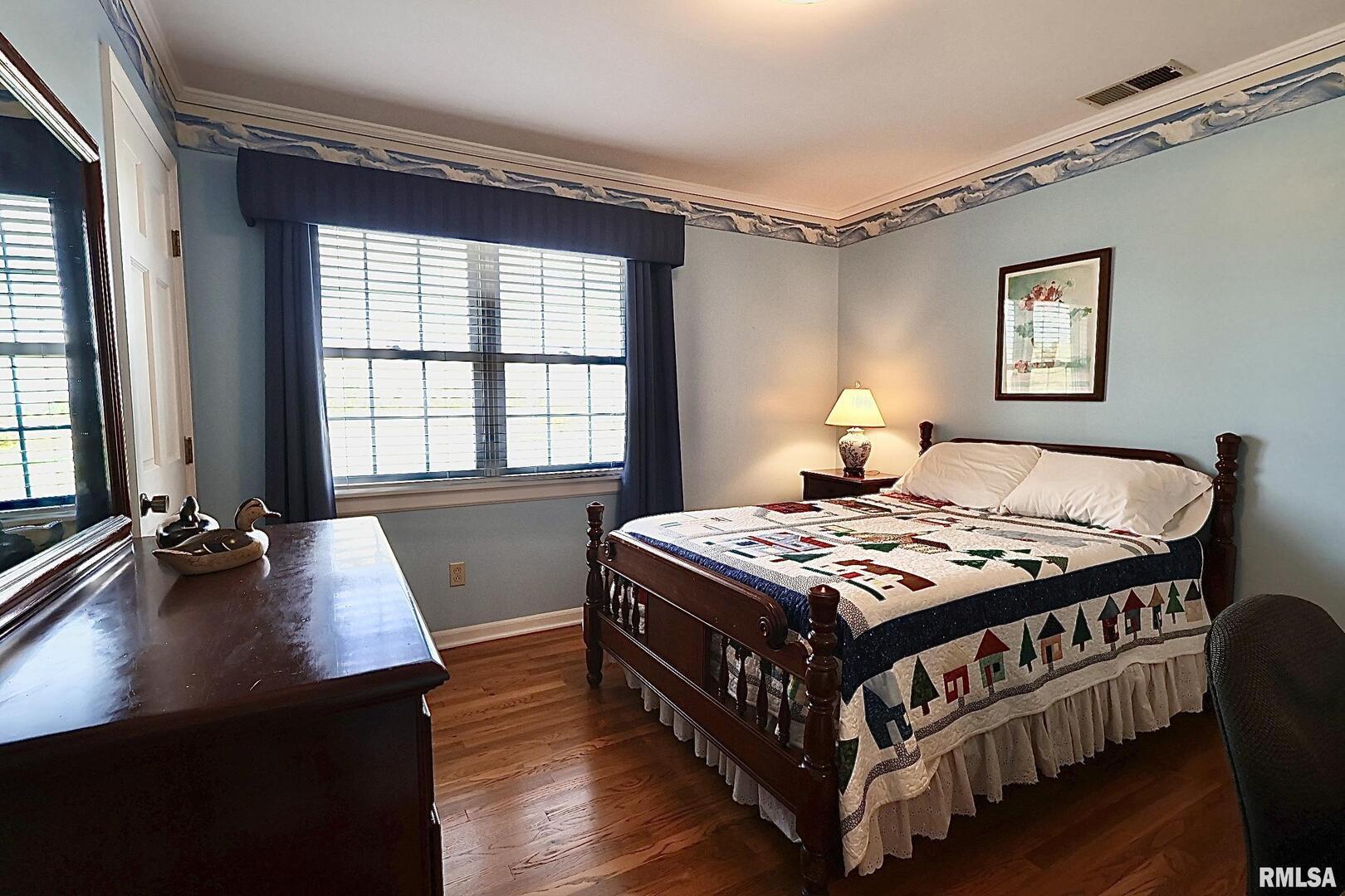 9879 Steel City Road Benton, IL 62812 - Photo 43 of 60 a bedroom with a bed and a desk