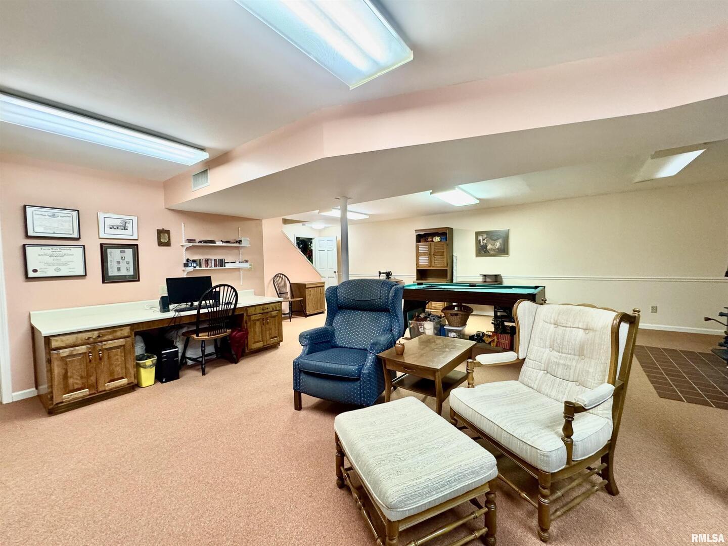9879 Steel City Road Benton, IL 62812 - Photo 48 of 60 a living room with furniture and a flat screen tv with wooden floor