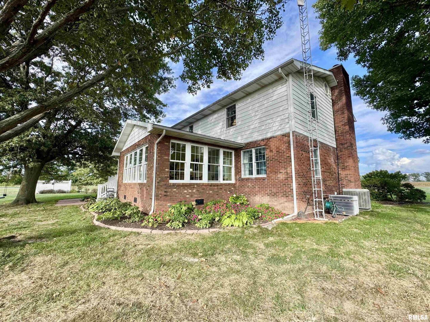 9879 Steel City Road Benton, IL 62812 - Photo 5 of 60 a front view of a house with a yard