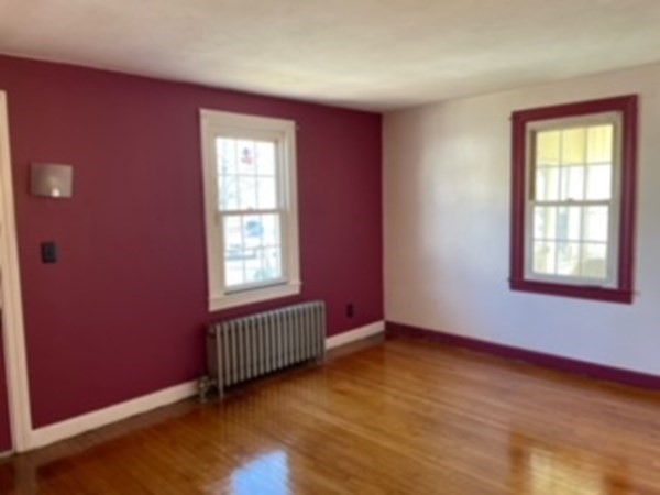 68 Fresno Street Springfield, MA 01104 - Photo 14 of 20 a view of an empty room window and wooden floor