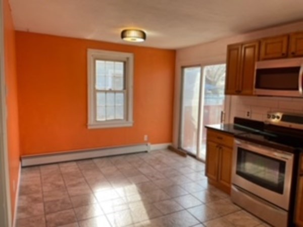 68 Fresno Street Springfield, MA 01104 - Photo 6 of 20 a view of a kitchen with an oven and cabinets