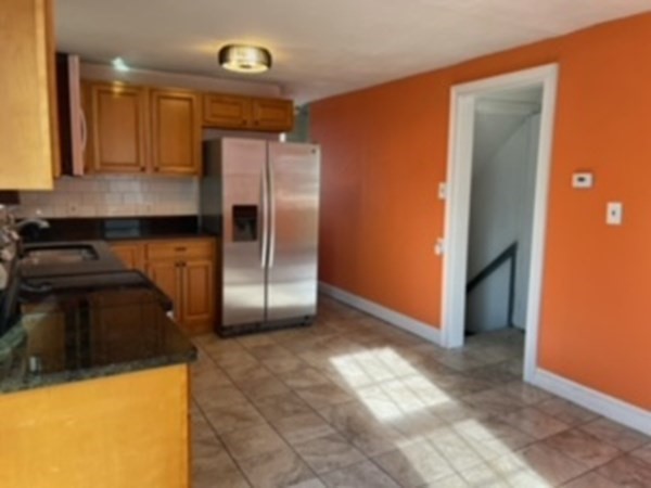 68 Fresno Street Springfield, MA 01104 - Photo 8 of 20 a kitchen with a refrigerator and a sink