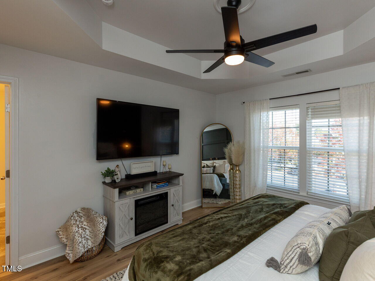 1117 Ileagnes Road Raleigh, NC 27603 - Photo 12 of 27 a bedroom with a bed and a flat screen tv