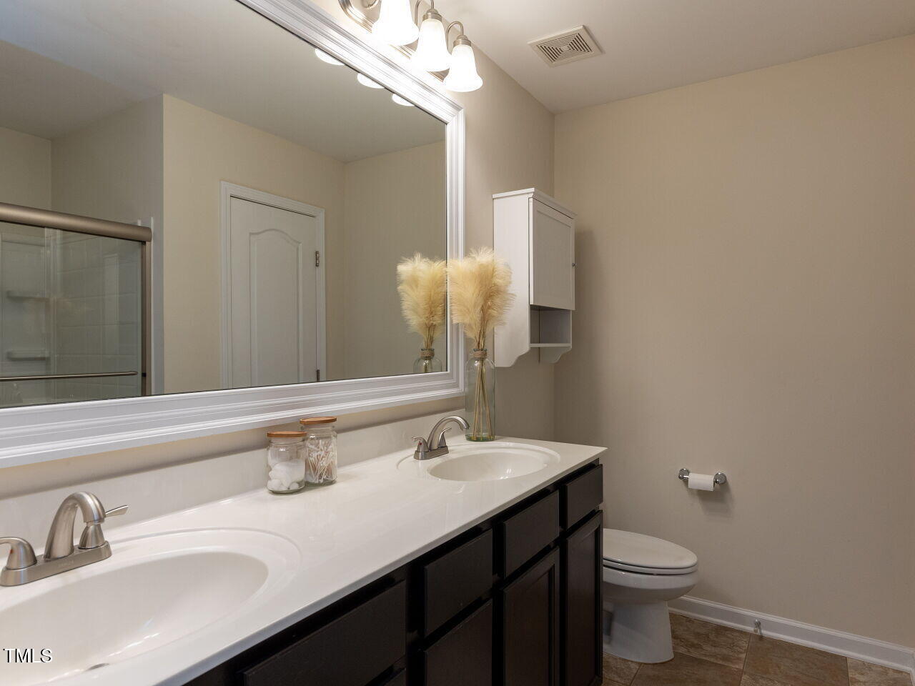 1117 Ileagnes Road Raleigh, NC 27603 - Photo 14 of 27 a bathroom with a sink vanity granite and toilet