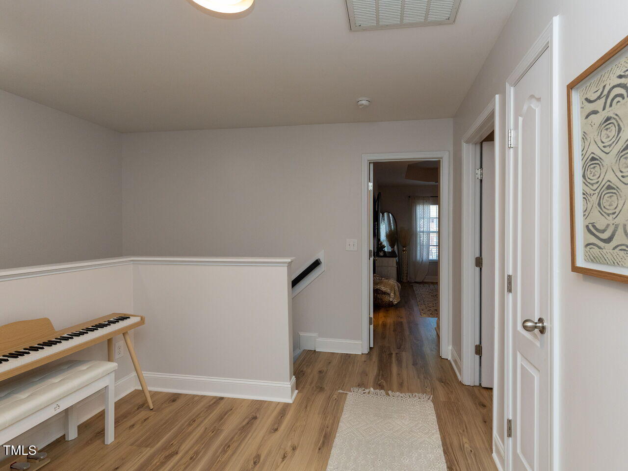 1117 Ileagnes Road Raleigh, NC 27603 - Photo 22 of 27 a view of hallway with wooden floor