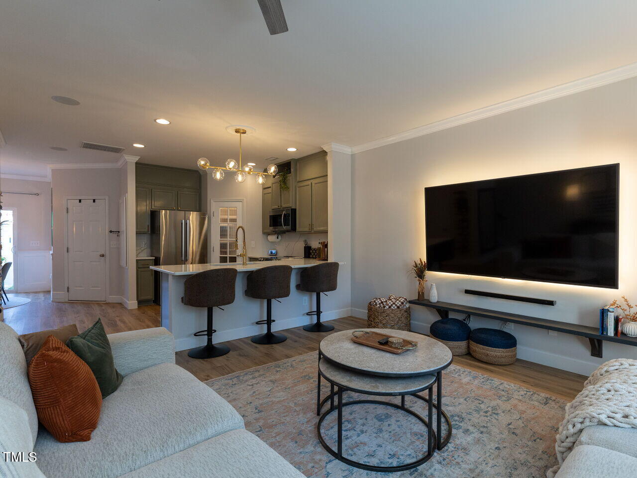 1117 Ileagnes Road Raleigh, NC 27603 - Photo 3 of 27 a living room with furniture and a flat screen tv