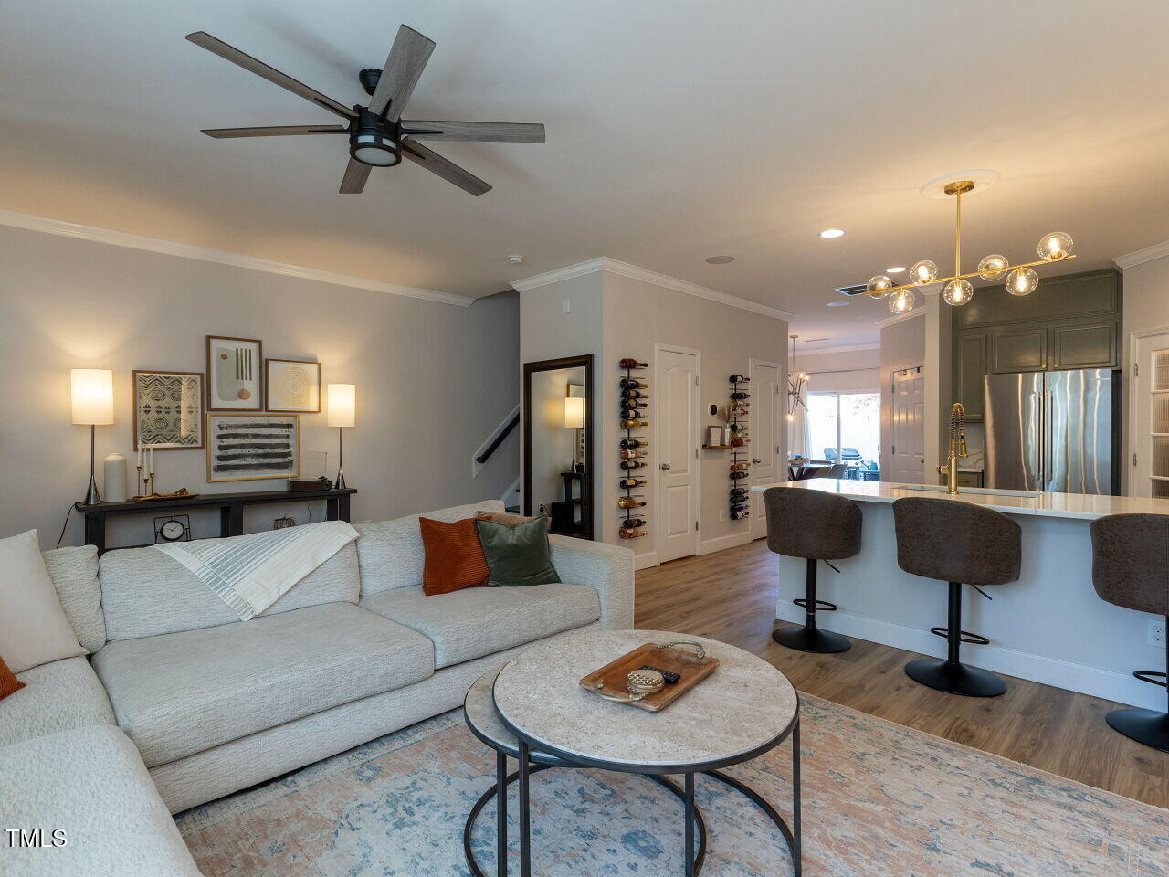 1117 Ileagnes Road Raleigh, NC 27603 - Photo 4 of 27 a living room with furniture and a lamp with wooden floor