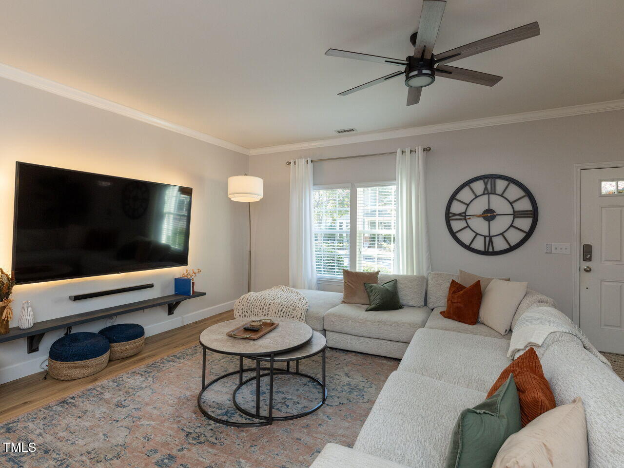 1117 Ileagnes Road Raleigh, NC 27603 - Photo 5 of 27 a living room with furniture and a flat screen tv