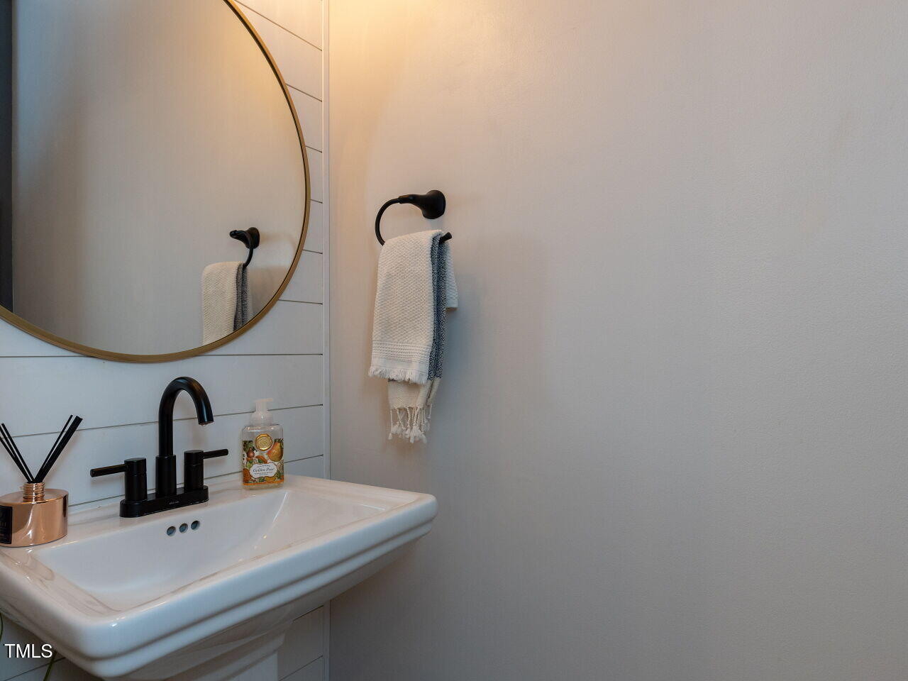 1117 Ileagnes Road Raleigh, NC 27603 - Photo 9 of 27 a bathroom with a sink and mirror